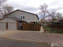 A long driveway leads to a two car garage at this property at 1015 Alta St, Longmont, CO 80501
