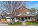 Charming two-story home with a welcoming front porch and an attached two-car garage, nestled on a well-maintained lawn at 1230 Tyler Pl, Erie, CO 80516