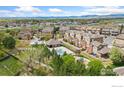 Aerial view of community featuring a pool, playground, and well-maintained landscaping at 12820 King St, Broomfield, CO 80020