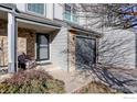 Welcoming front porch with gray brick and door, creating a cozy entrance to the home at 1978 E 102Nd Cir, Thornton, CO 80229