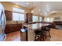 Modern kitchen with granite countertops and stainless-steel appliances at 2196 Winding Dr, Longmont, CO 80504