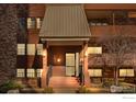 Building exterior showcasing the entrance of the building, with well-maintained landscaping and classic architectural details at 252 N Pennsylvania St # 305, Denver, CO 80203
