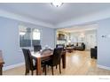 Dining room with hardwood floors and view into living room at 3441 W 45Th Ave, Denver, CO 80211