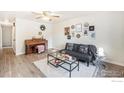 Bright living room featuring modern décor, wood floors, comfortable seating, and ample natural light at 417 E 4Th Ave, Longmont, CO 80504