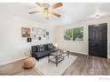 Comfortable living room featuring modern décor, hardwood floors, and plenty of natural light at 417 E 4Th Ave, Longmont, CO 80504