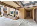 Charming building entrance with mature plantings and inviting outdoor space at 4475 Laguna Pl # 206, Boulder, CO 80303