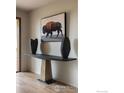 Chic entryway featuring modern console table, vases, and art, creating a stylish welcome at 50 Wildwood Ln, Boulder, CO 80304