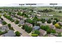 An aerial view of the neighborhood shows proximity to the Disc Golf Course, Carbon Valley Regional Library, and Saddleback Golf Course at 5822 Shenandoah Ave, Firestone, CO 80504
