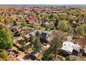 Bird's-eye view of a residential area featuring homes with green lawns and mature trees at 845 14Th St, Boulder, CO 80302