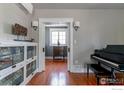 Charming living room with hardwood floors, white trim, and a bright window at 845 14Th St, Boulder, CO 80302