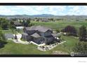 Beautiful two-story home with mature landscaping and mountain views at 1105 Shelby Dr, Berthoud, CO 80513