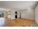 Spacious living area featuring hardwood floors and ample natural light at 13580 Eliot Ct, Broomfield, CO 80020