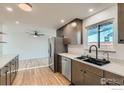 Beautifully updated kitchen featuring stainless steel appliances, sleek cabinetry, and bright countertops at 1430 Lashley St, Longmont, CO 80504