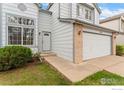 Charming two-story home with a well-maintained lawn, brick accents and attached two-car garage at 1842 Reliance Cir, Superior, CO 80027