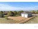 Spacious detached two-car garage with ample parking and a fenced yard in a serene setting at 18553 Wagon Trl, Mead, CO 80542