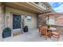 Charming front porch featuring a seating area and a welcoming entrance with a decorative wreath at 4203 Rabbit Mountain Rd, Broomfield, CO 80020
