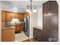 Modern kitchen design features stainless steel appliances, hardwood floors and granite countertops at 4500 Baseline Rd # 3302, Boulder, CO 80303