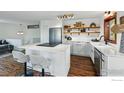 Bright kitchen with white cabinets, stainless steel appliances, and modern countertops at 4731 Jay Rd, Boulder, CO 80301