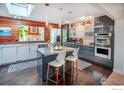 Stylish kitchen showcasing a central island with seating, modern cabinetry, and stainless steel appliances at 560 Iris Ave, Boulder, CO 80304
