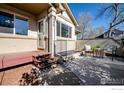 Charming front porch with cozy outdoor seating, perfect for enjoying the neighborhood views and the beautiful weather at 650 Ridgeview Dr, Louisville, CO 80027