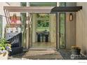 Inviting entryway with a water feature leading to an office with natural light and views of the front yard at 7323 Old Post Rd, Boulder, CO 80301