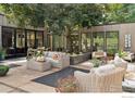 Outdoor patio with comfortable seating, lush landscaping, and ample space for relaxing and entertaining at 7323 Old Post Rd, Boulder, CO 80301