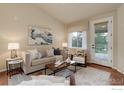 Comfortable living room with contemporary decor, including stylish sofa, rug, and artwork, creating a relaxing ambiance at 8255 E 150Th Pl, Thornton, CO 80602