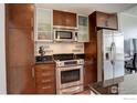 Updated kitchen features stainless steel appliances and granite countertops at 891 14Th St # 3815, Denver, CO 80202