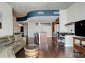 Inviting living room with hardwood floors, modern furniture, and a kitchen island at 891 14Th St # 3815, Denver, CO 80202