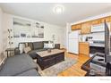Inviting living room and kitchen combo with warm wood floors at 961 16Th St # 4, Boulder, CO 80302