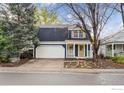 Charming two-story home with a well-maintained front yard and attached two-car garage at 1032 Pegasus Pl, Lafayette, CO 80026