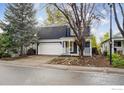 Charming two-story home with a well-maintained front yard and attached two-car garage at 1032 Pegasus Pl, Lafayette, CO 80026