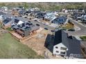 A new construction neighborhood showing several modern homes under construction and completed at 1039 Turnberry Cir, Louisville, CO 80027