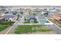 Scenic aerial view showcases the property's ample yard space and community surroundings at 11500 E 162Nd Dr, Brighton, CO 80602