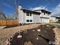 Charming two-story home featuring mature landscaping and a well-manicured front yard at 16807 E Napa Dr, Aurora, CO 80013