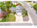 Aerial view of the property showcasing the home, landscaping, and neighborhood at 5151 S Quintero St, Centennial, CO 80015