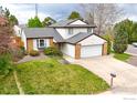 Well-maintained two-story home with a spacious lawn and attached two-car garage at 5151 S Quintero St, Centennial, CO 80015