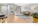 Living area with hardwood floors, open plan and bright natural light at 540 S Forest St # 7-102, Denver, CO 80246