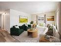 Spacious living room with modern furnishings, soft natural light, and neutral color palette at 740 Lotus Way, Broomfield, CO 80020