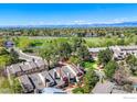 Aerial view of a townhouse neighborhood next to Nottingham Park with mountain views in the distance at 8750 Allison Dr # B, Westminster, CO 80005