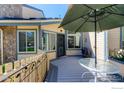 Outdoor patio with table, grill, decorative fence, and an awning for shade at 8750 Allison Dr # B, Westminster, CO 80005