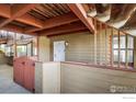Charming condo entrance with a private patio, quaint fencing and well-maintained exterior at 8770 Corona St # 101, Denver, CO 80229