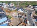 Aerial view of a home under construction in a residential neighborhood; foundation visible at 933 Saint Andrews Ln, Louisville, CO 80027