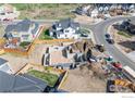 Aerial view of a home under construction, showcasing the foundation and surrounding neighborhood at 933 Saint Andrews Ln, Louisville, CO 80027