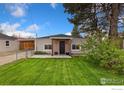 Charming single story home featuring a tidy front lawn, craftsman accents, and welcoming front porch at 109 S Fulton Ave, Fort Lupton, CO 80621