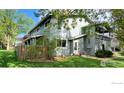 Charming home with covered porch and lush green lawn, offering serene outdoor living at 1180 Monroe Dr # C, Boulder, CO 80303