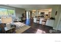 Inviting living room and kitchen featuring wood floors and lots of natural light at 1180 Monroe Dr # C, Boulder, CO 80303