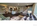Cozy living room and open kitchen with modern white cabinets, stainless appliances at 1180 Monroe Dr # C, Boulder, CO 80303