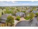 Aerial view of a charming neighborhood with lush greenery and well-maintained homes at 14100 Doral Ct, Broomfield, CO 80023