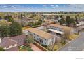 An attractive aerial view of the property showcasing neighborhood and tree-lined street at 1915 S Oakland Way, Aurora, CO 80014